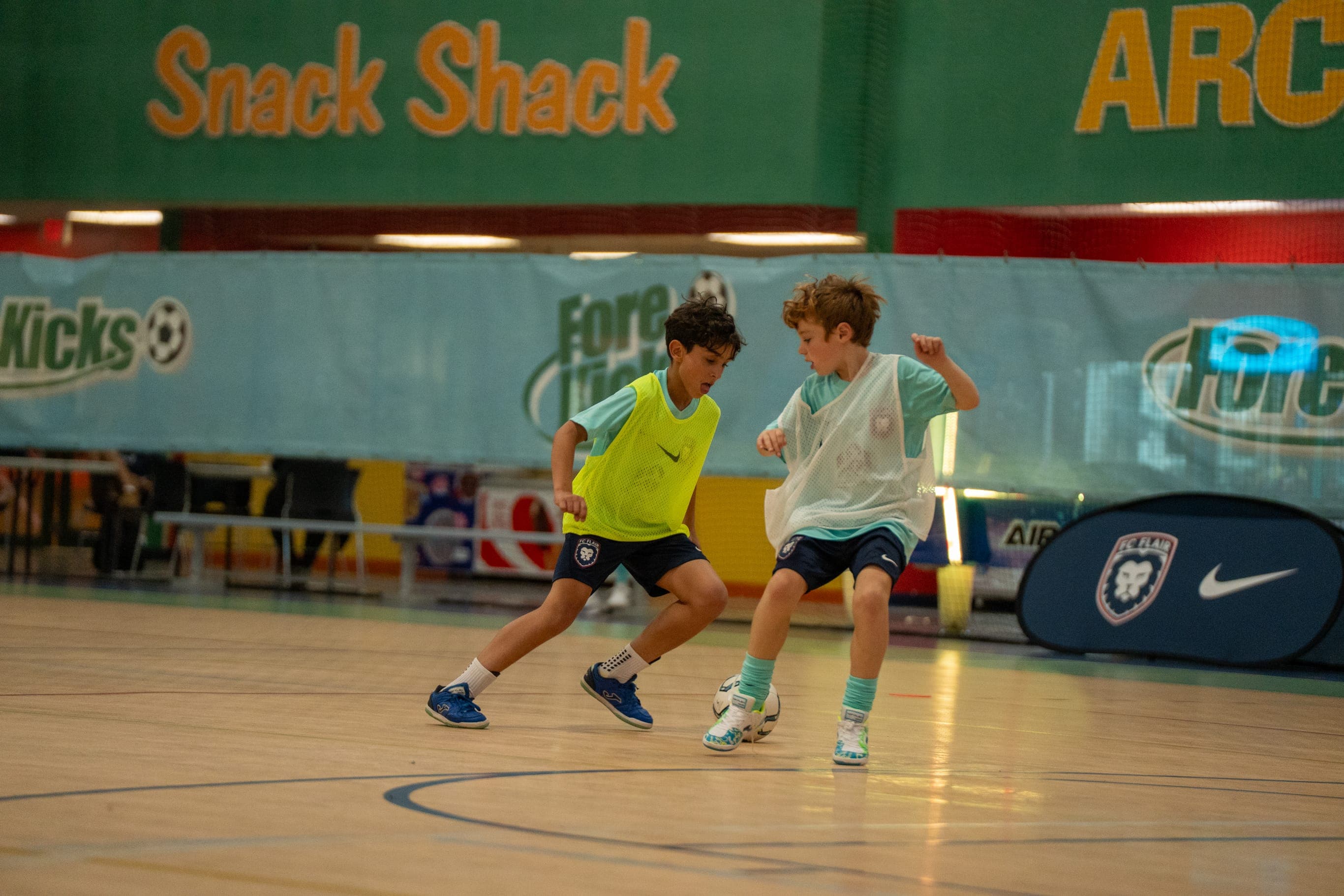 Two FC Flair players battling for the ball