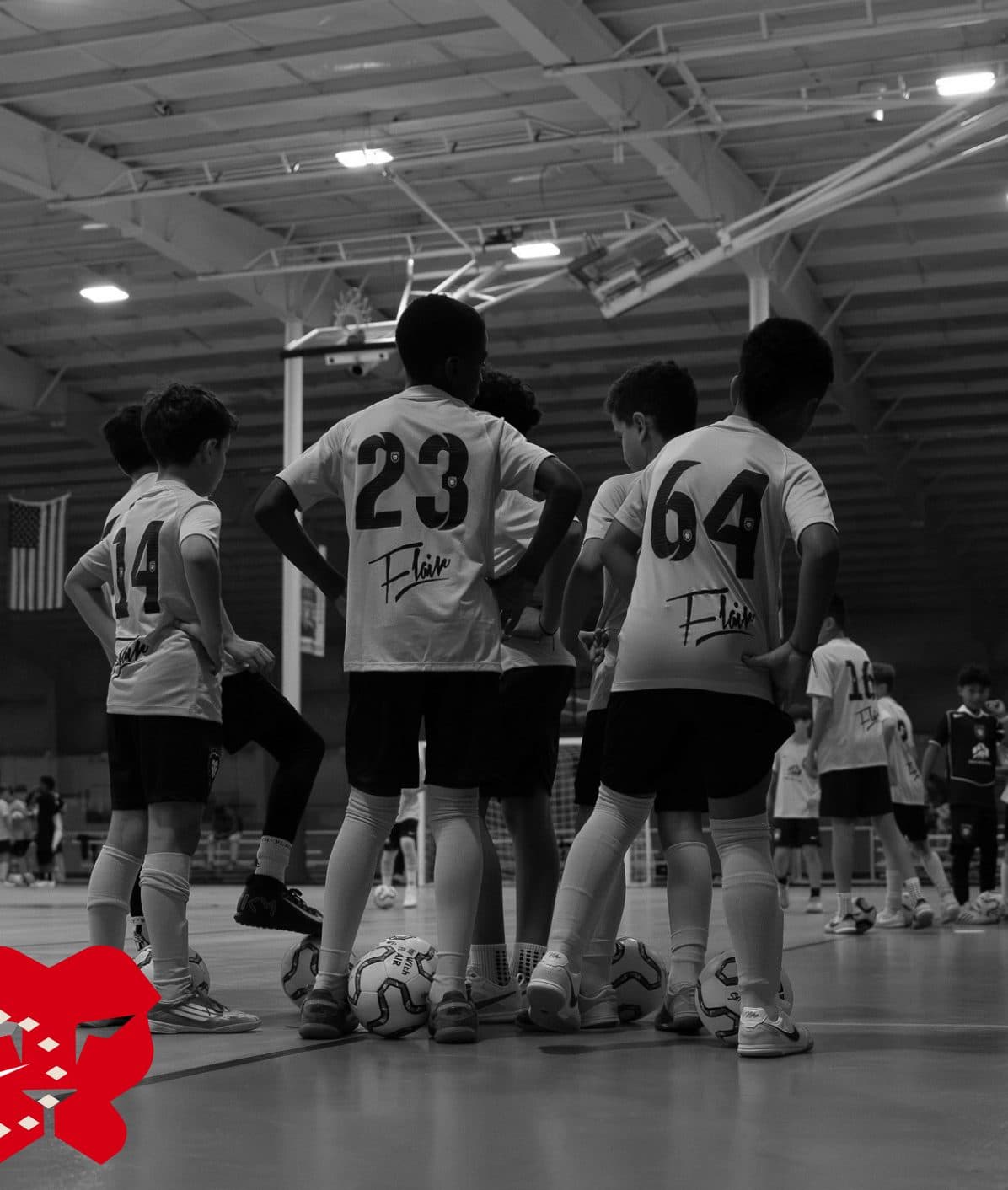 FC Flair players huddled on the court